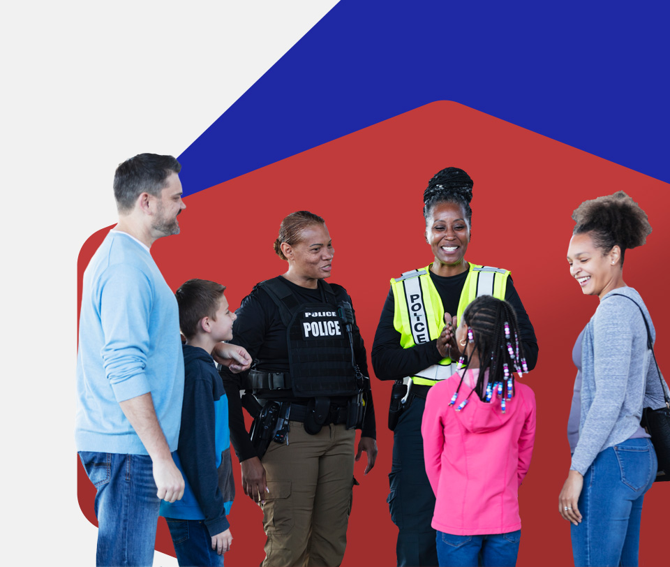 Group of people chatting with a first responder.